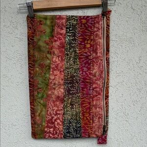 Handmade pouch. One zipper pocket and one pocket pocket. Reds, greens, browns